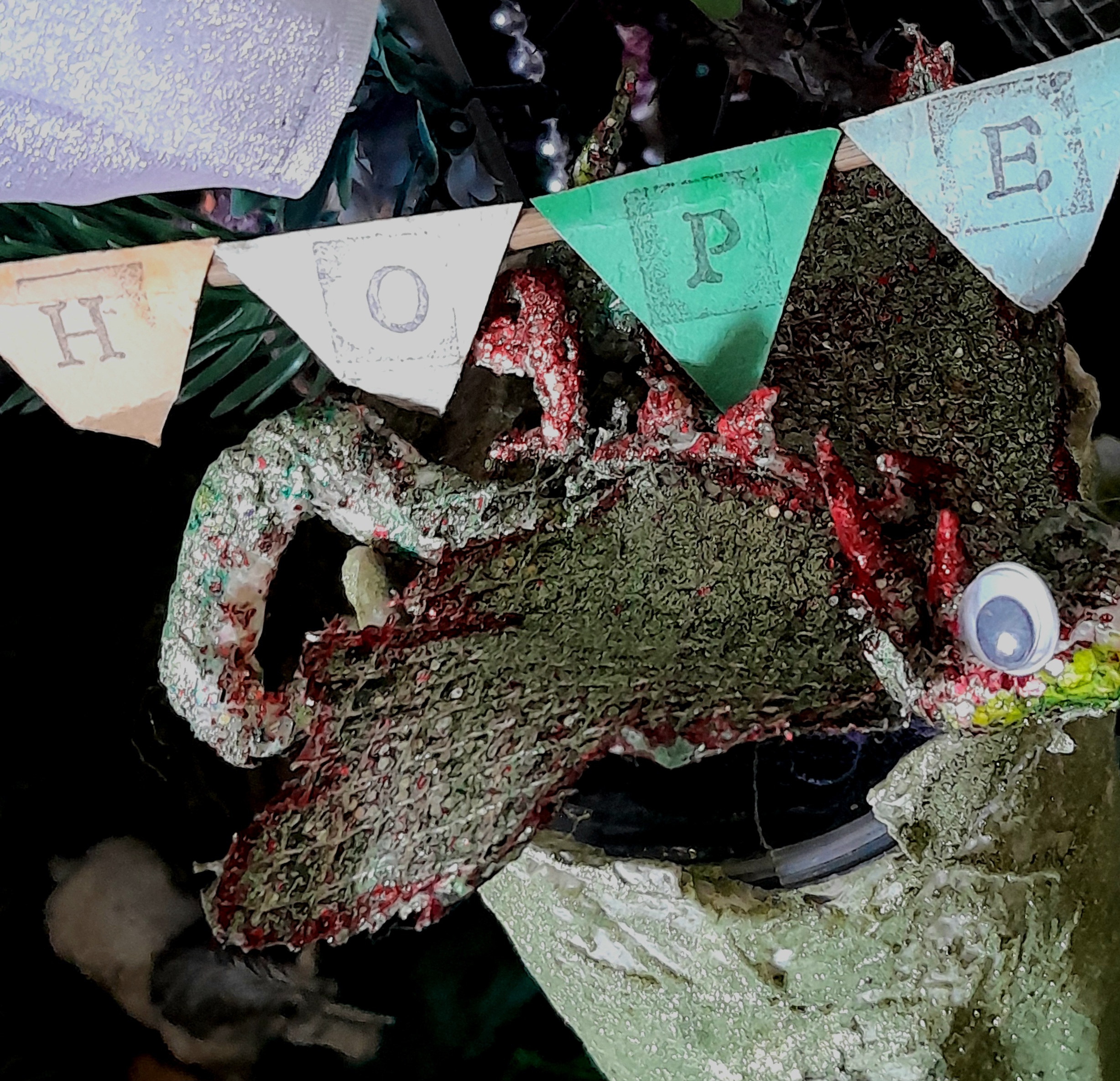 A glittery dragon under a banner reading Hope